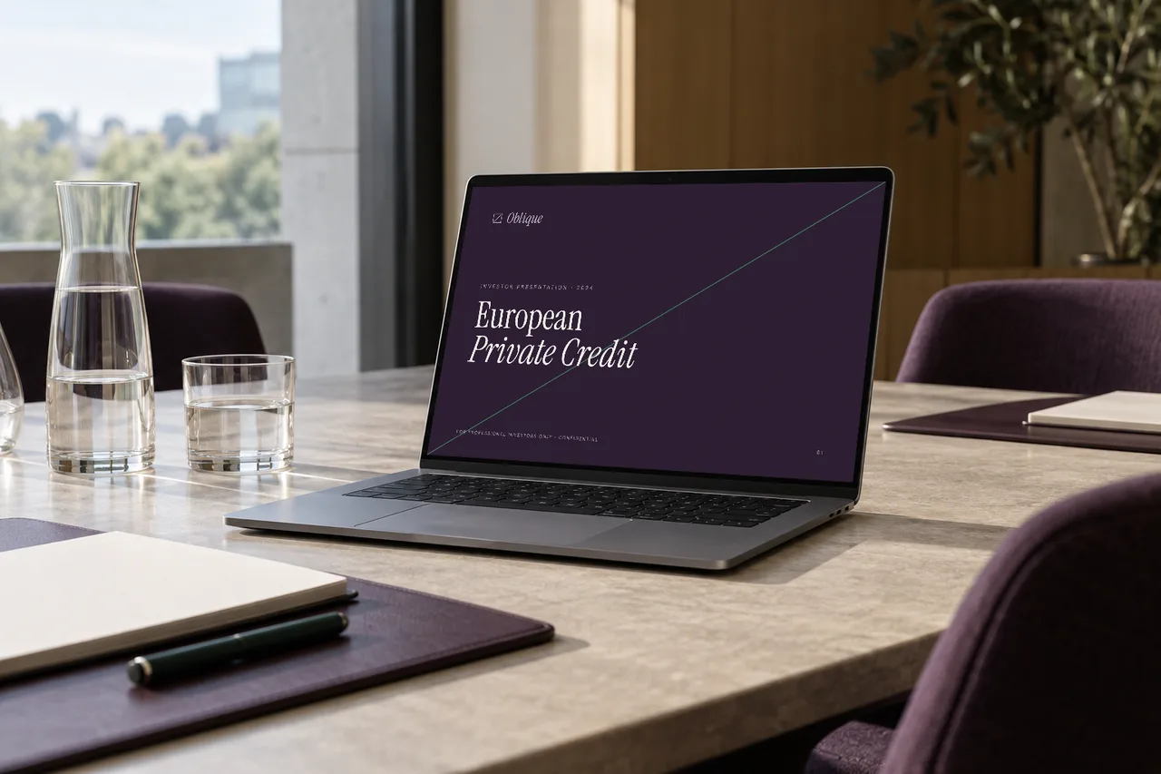 A laptop in a meeting room showing the first page of an investor presentation